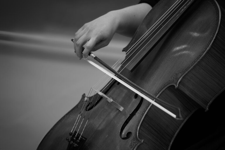 A person playing the cello with a bow.